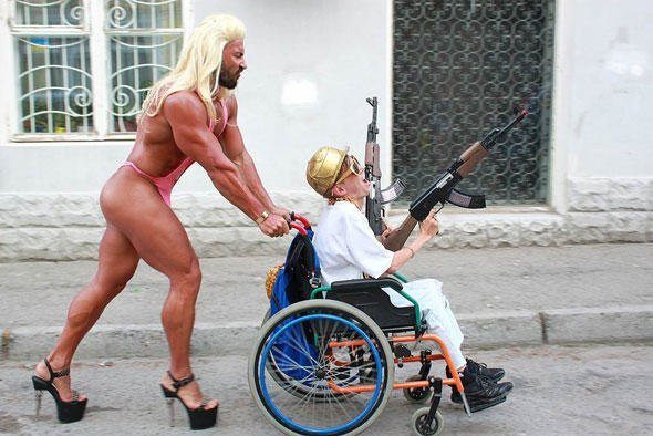 funny-wtf-wheelchair-gun-cross-dress