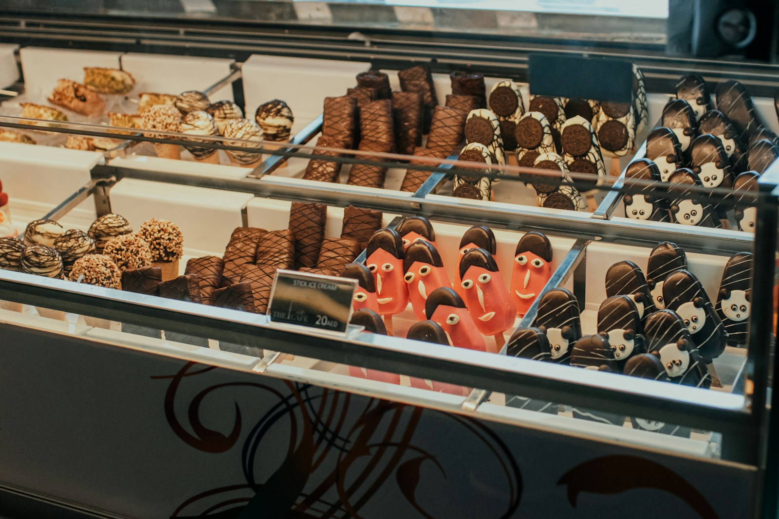 a display case filled with lots of different types of desserts