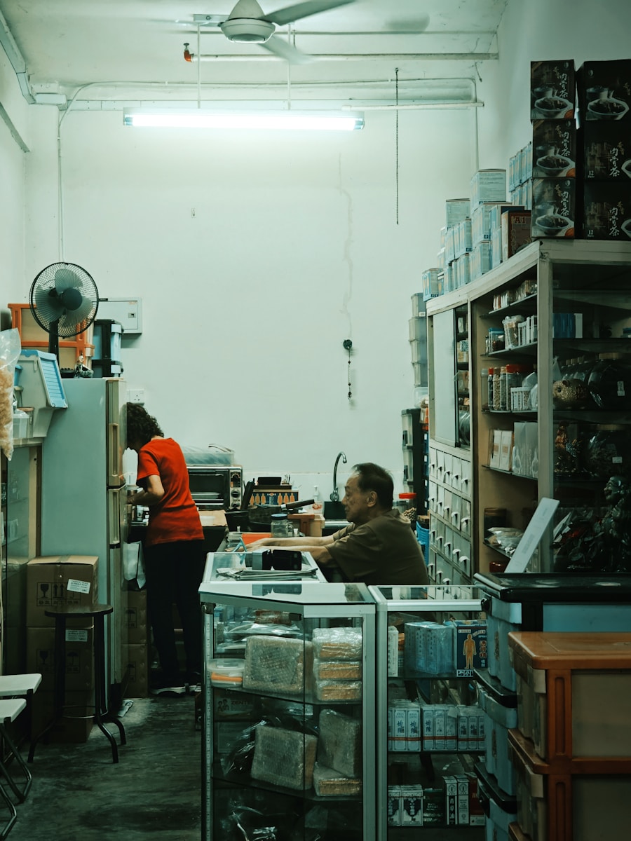 A man and a woman working in a warehouse