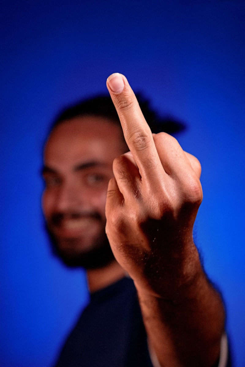 a man making a hand sign with his fingers