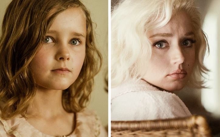 Dievča s vlnitými hnedými vlasmi vedľa ženy s kratšími blond vlasmi, obe pozerajú do kamery.