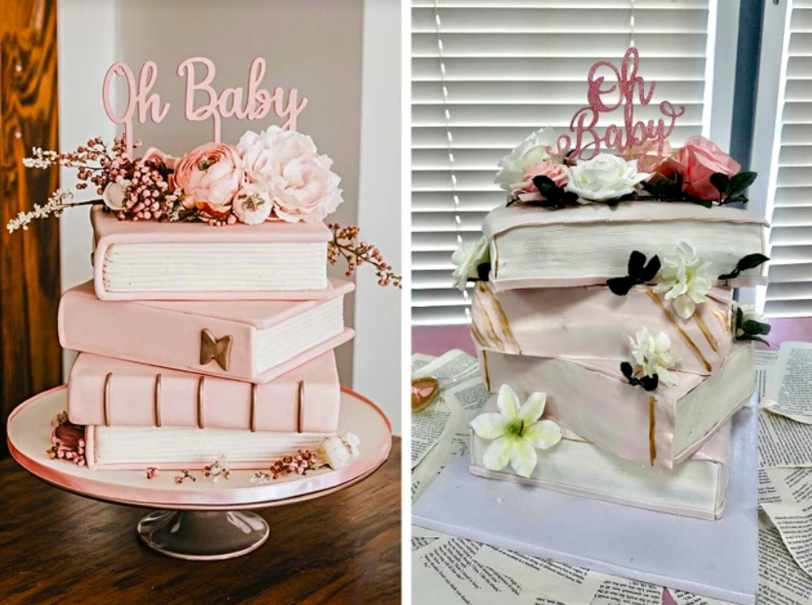Ružová torta v tvare kníh na oslavu bábätka, ozdobená kvetmi a nápismi Oh Baby.