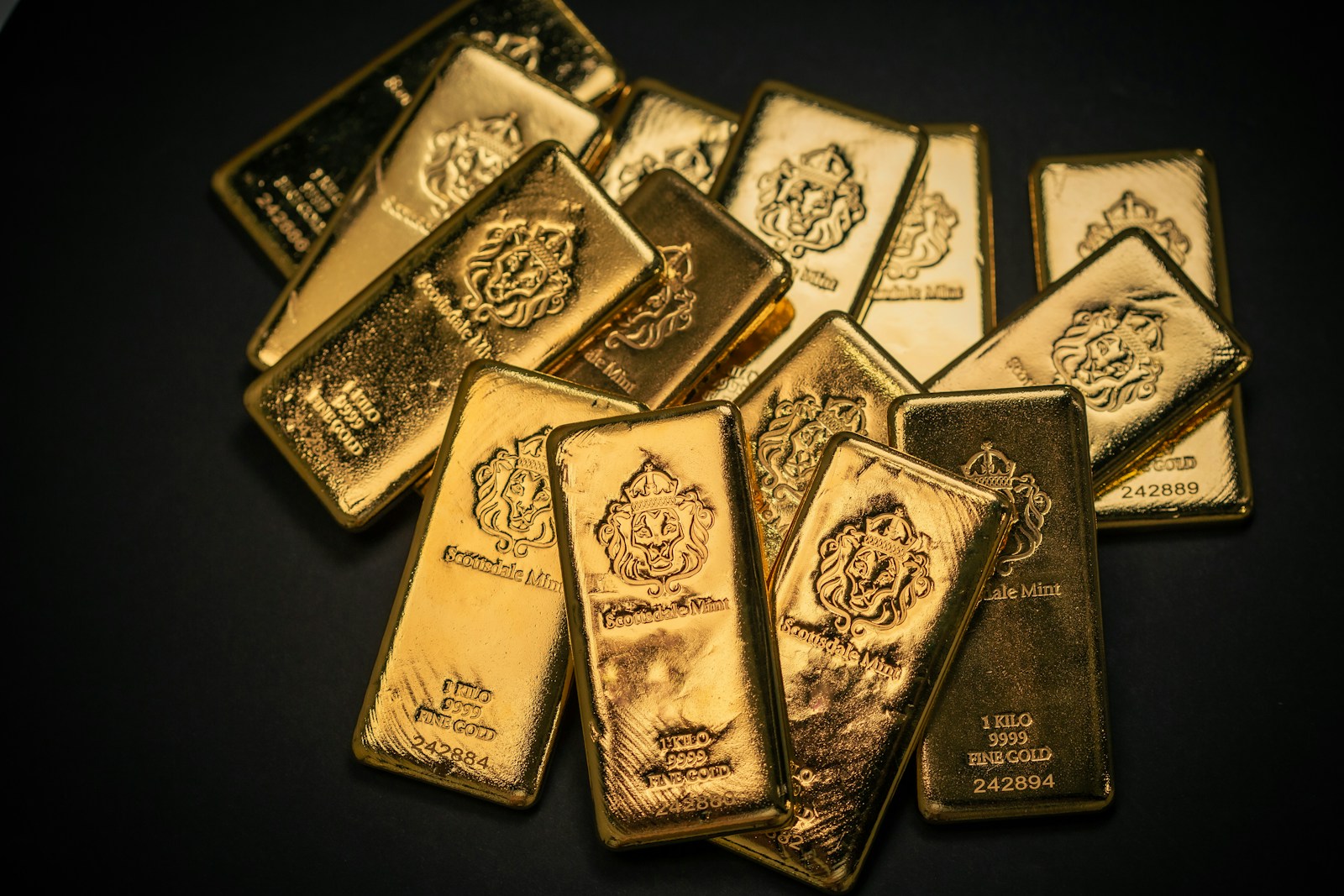 A pile of gold bars sitting on top of a table