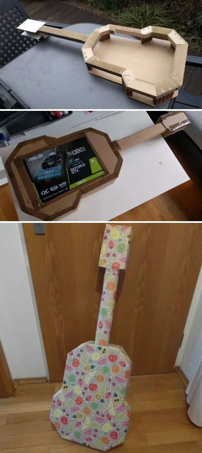 DIY kartónová gitara vytvorená z obalu na grafickú kartu, farebne zabalená do ovocného papiera.